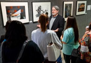 Sept. 3, 2016 LES HASSELL/NEWS-JOURNAL PHOTO Photographer and Kilgore College instructor O. Rufus Lovett talks to students recently about his work on display at the Ann Dean Turk Fine Arts Center.